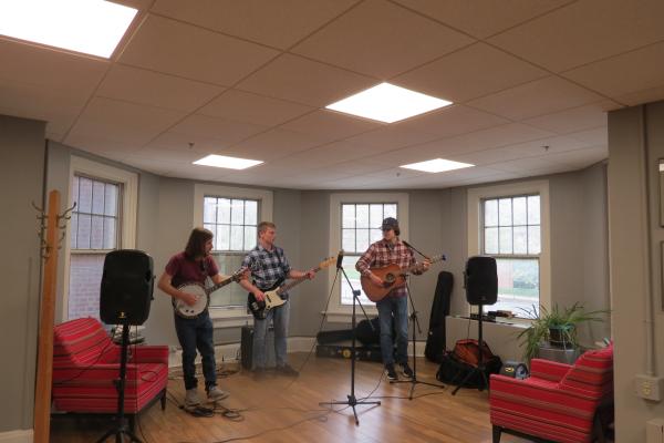 Linguistics student Simon Grome performs with his band at the end-of-year party