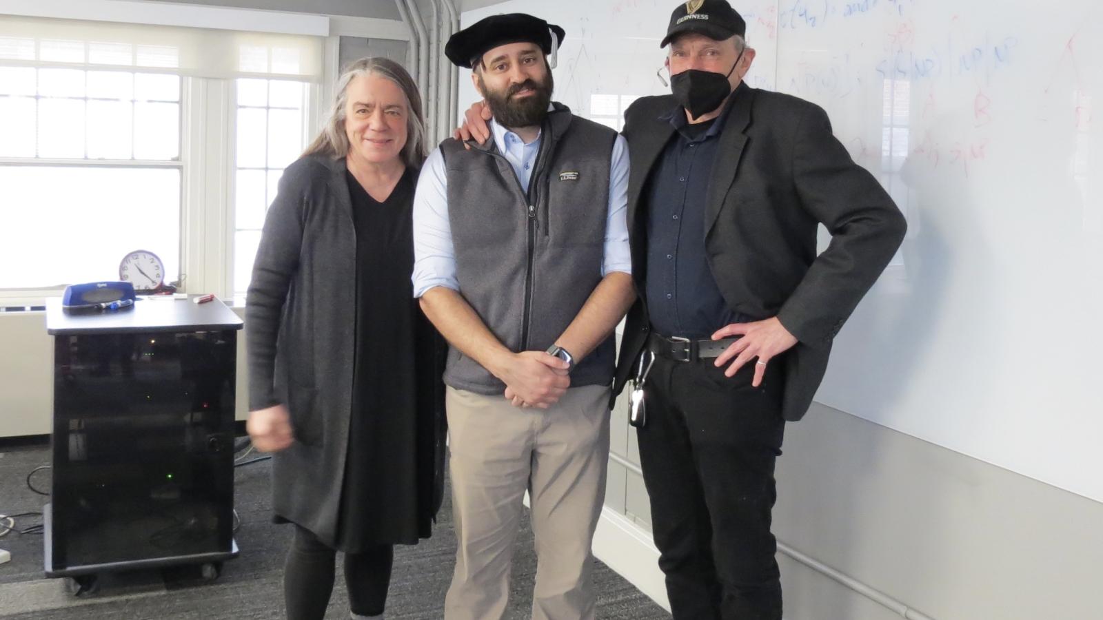 Daniel Puthawala with advisors Shari Speer and Bob Levine after his successful defense