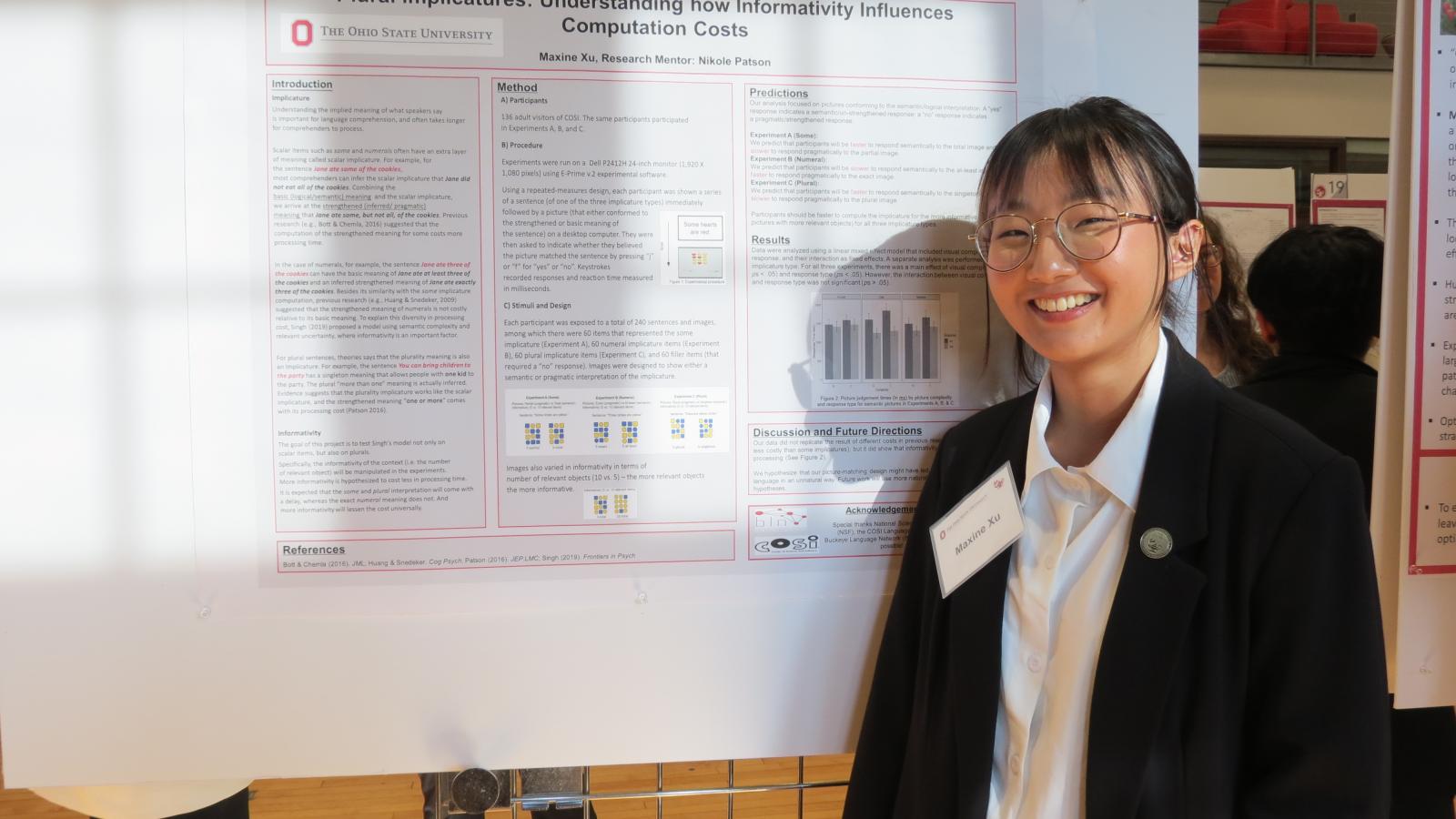 Maxine Xu with her poster at the Denman