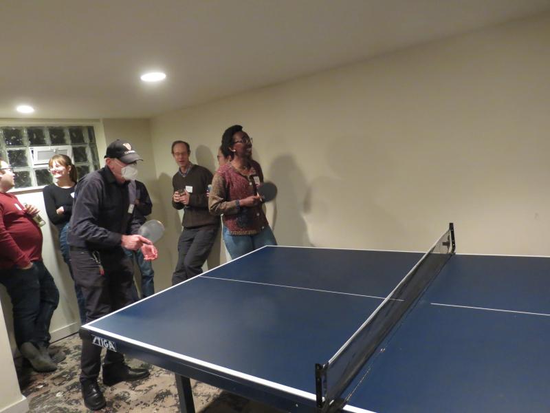 Bob Levine plays table tennis with one of the prospective students