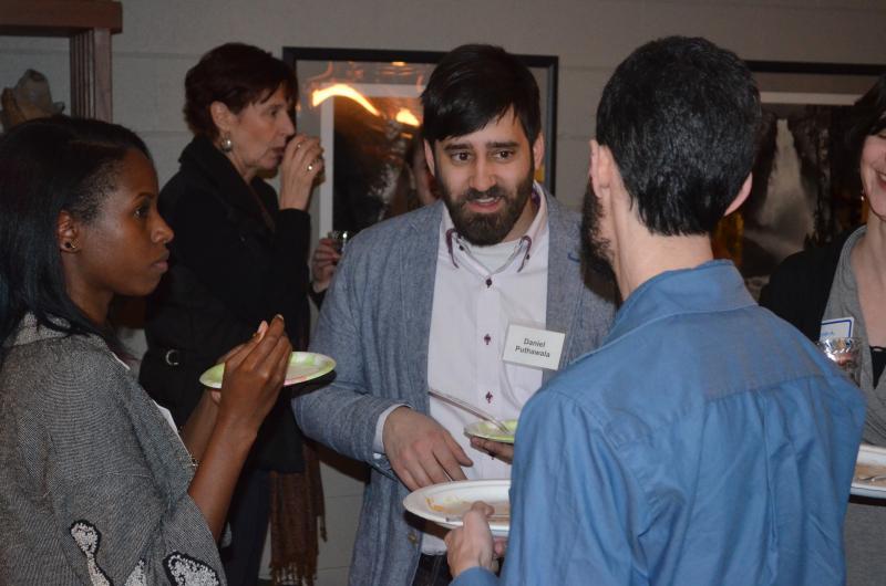Prospective students chat with faculty at a recruiting event