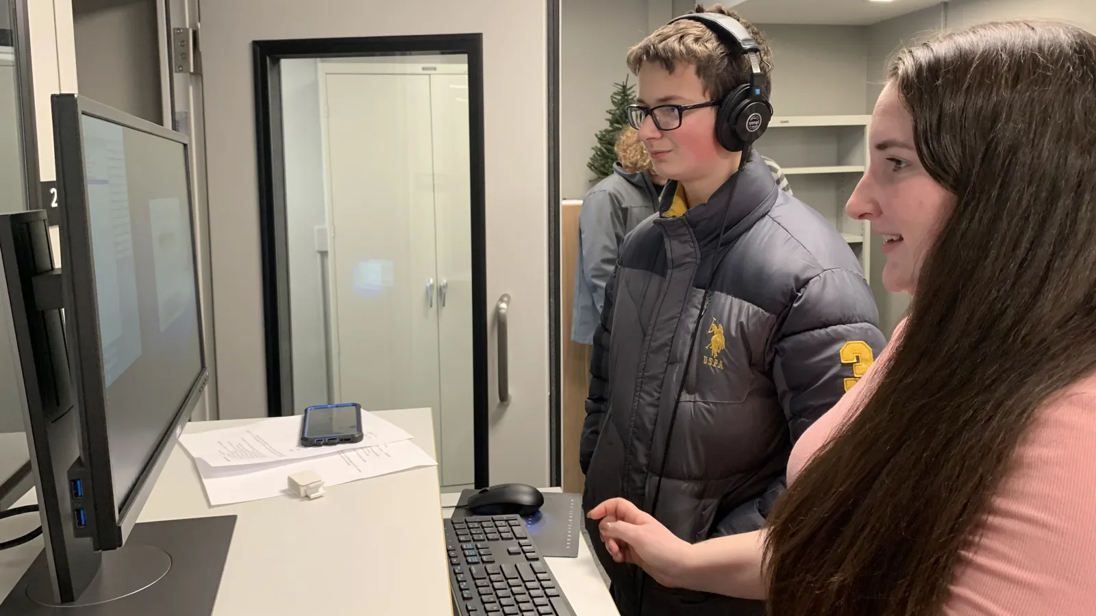 Instructor Carly Dickerson (right) works with a Metro student during a visit to Oxley