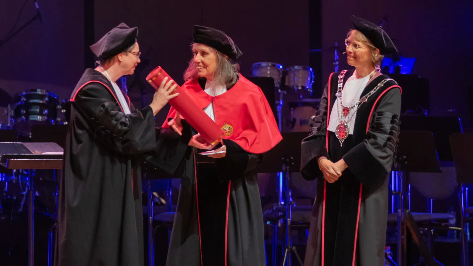 Mary Beckman accepting her honorary doctorate from Radboud University