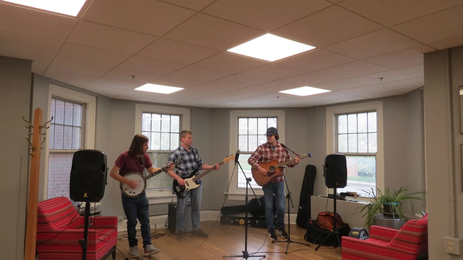 Linguistics student Simon Grome performs with his band at the end-of-year party