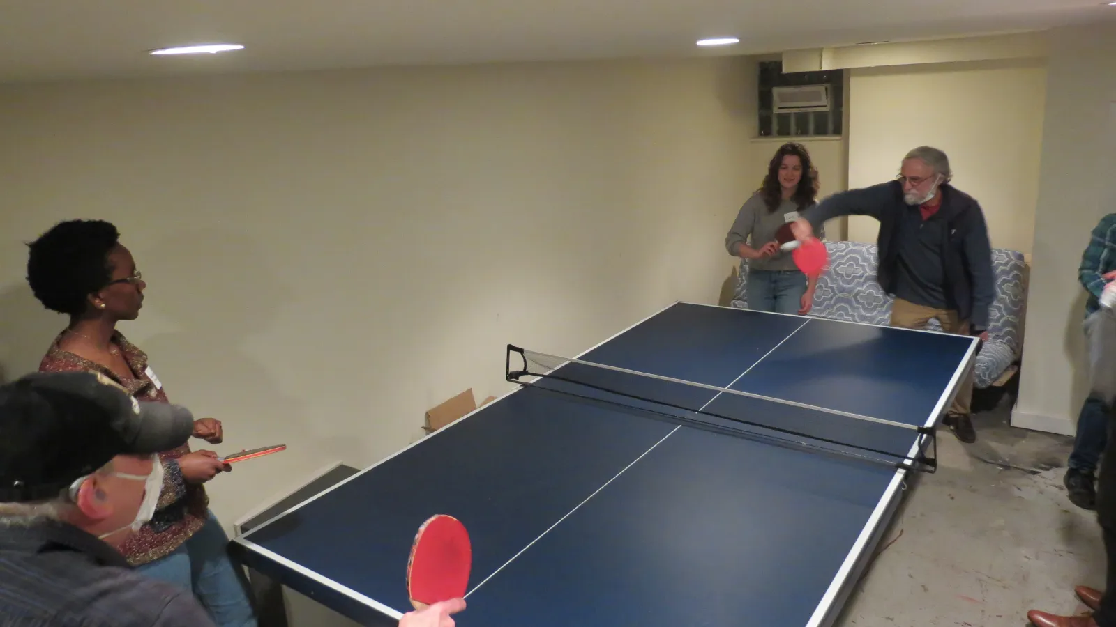 Brian playing ping pong with Bob Levine at a department party