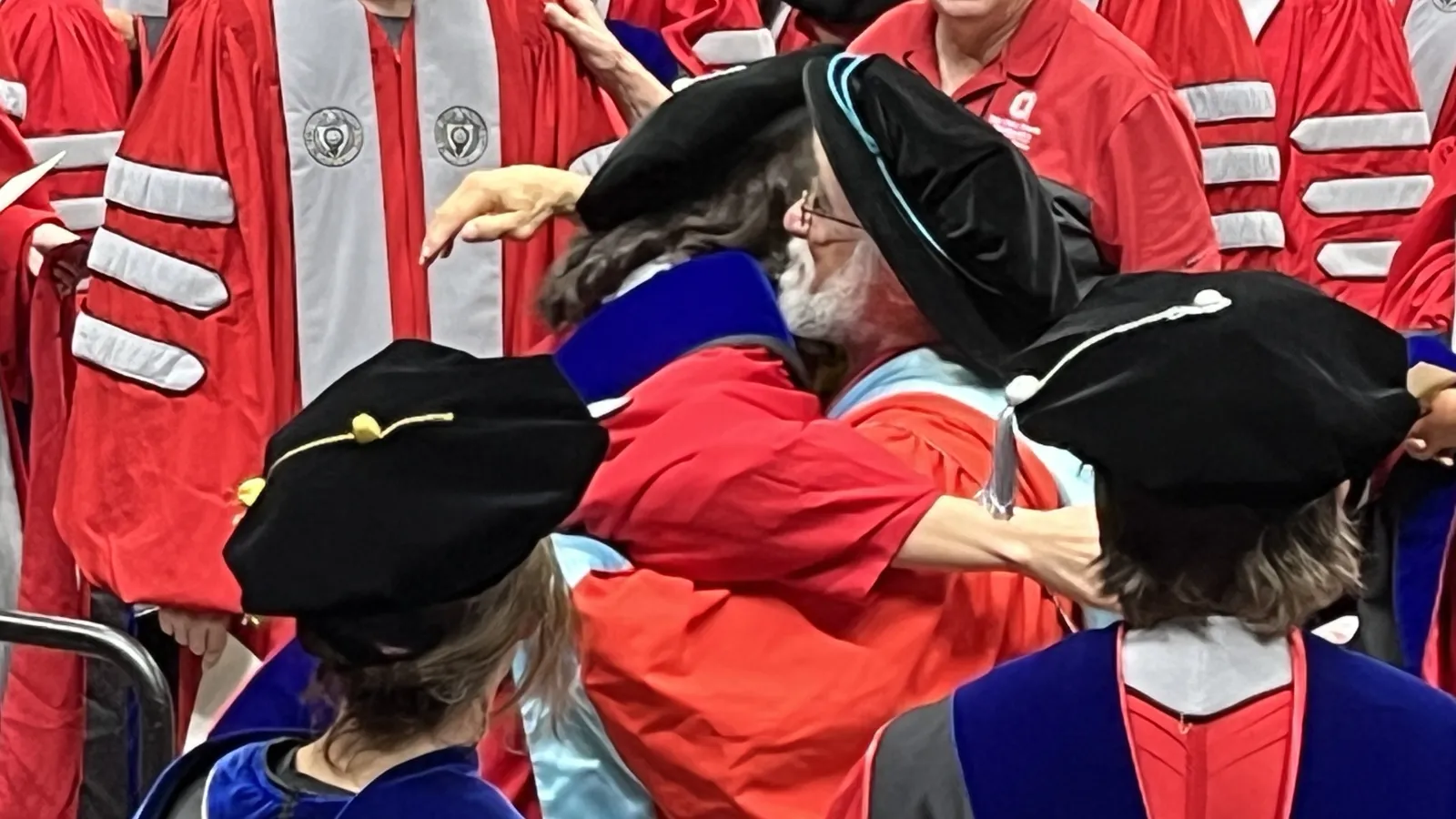 Xhina Ndoci is hooded by advisor Brian Joseph