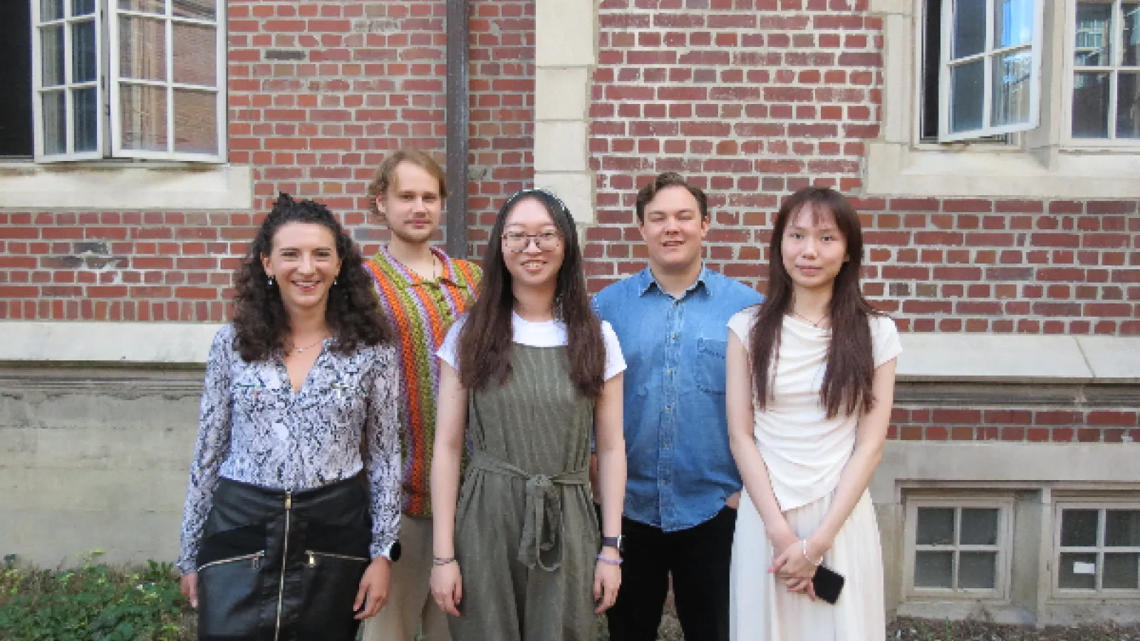5 new graduate students standing in front of Oxley Hall
