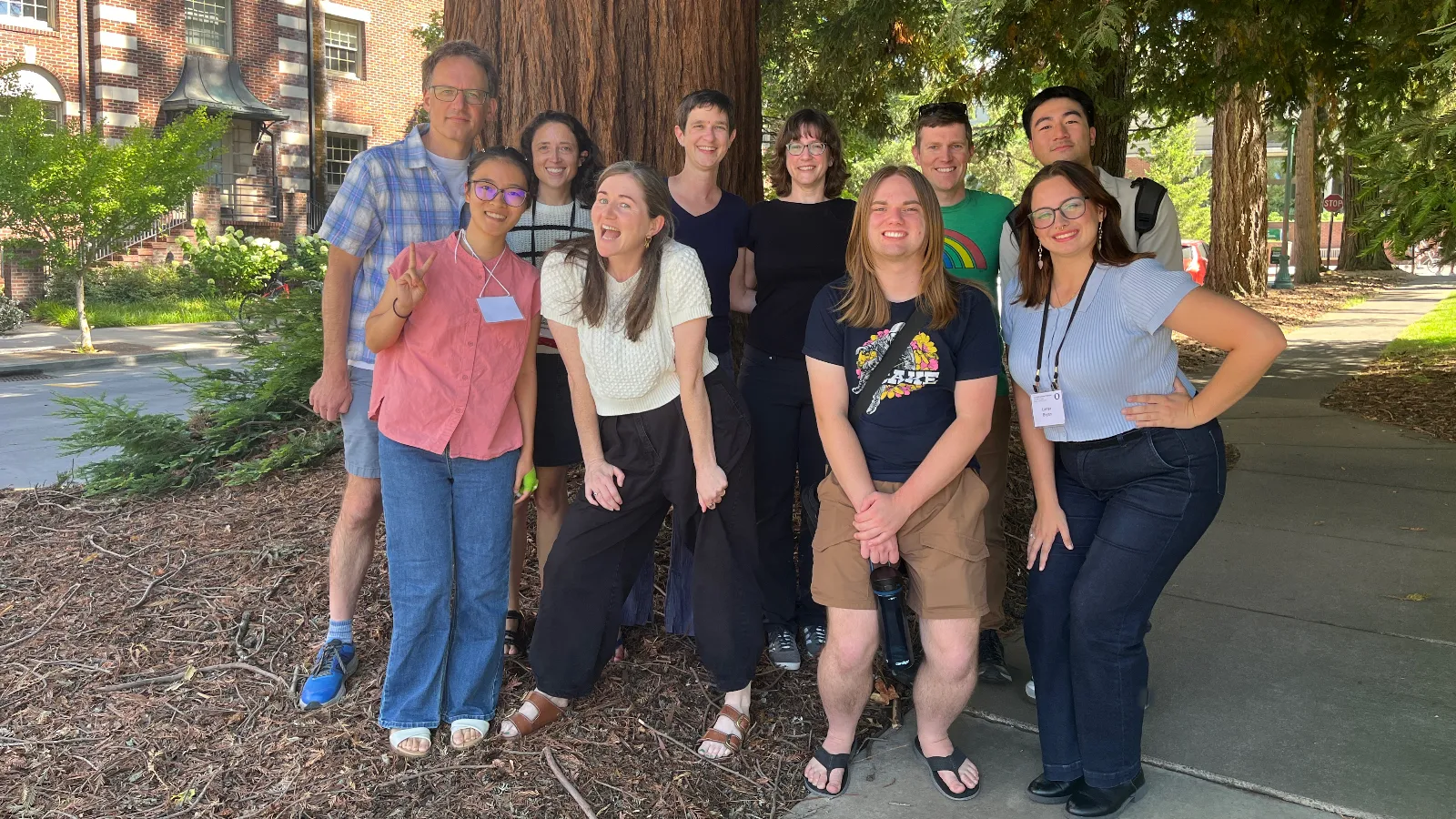 LSA participants standing and posing in front of trees