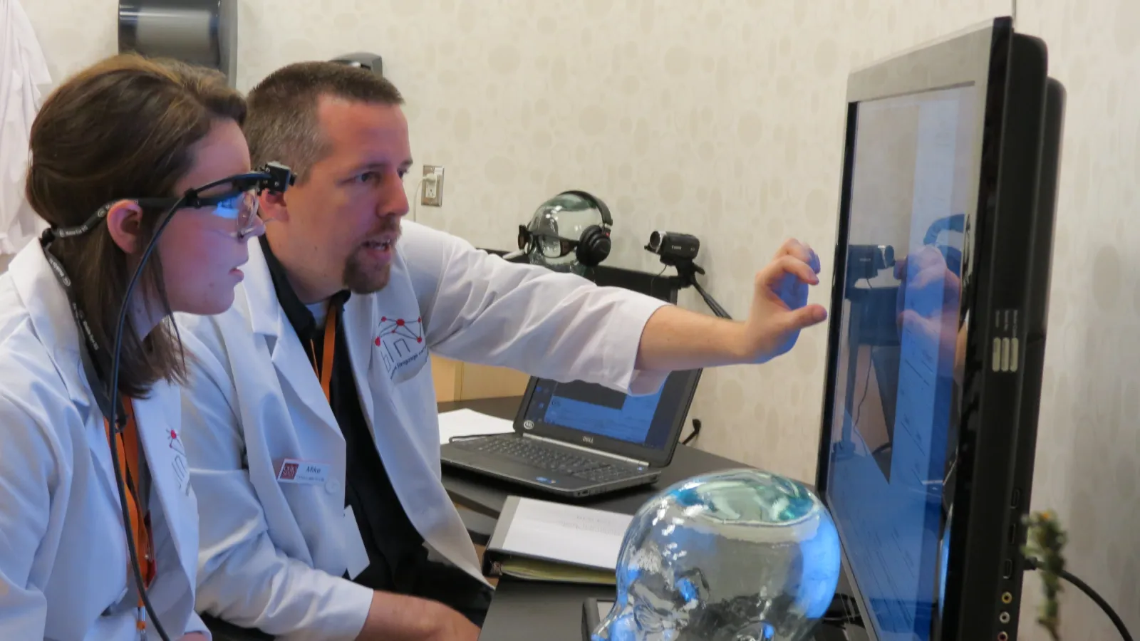 COSI lab members work with the equipment