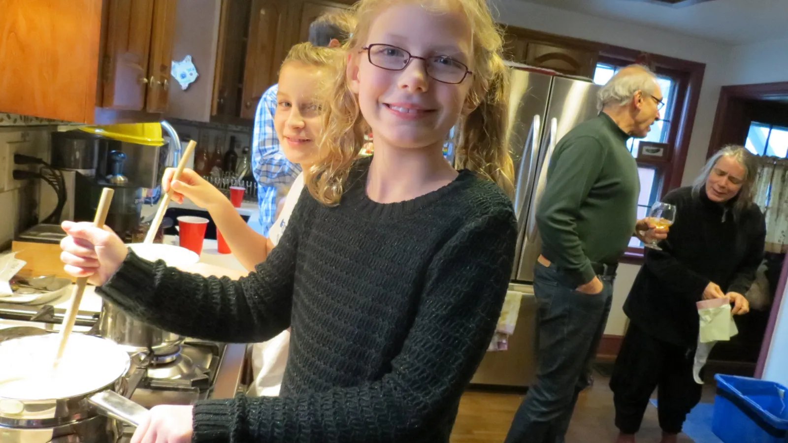 Maryam Harmon makes candy at the holiday party