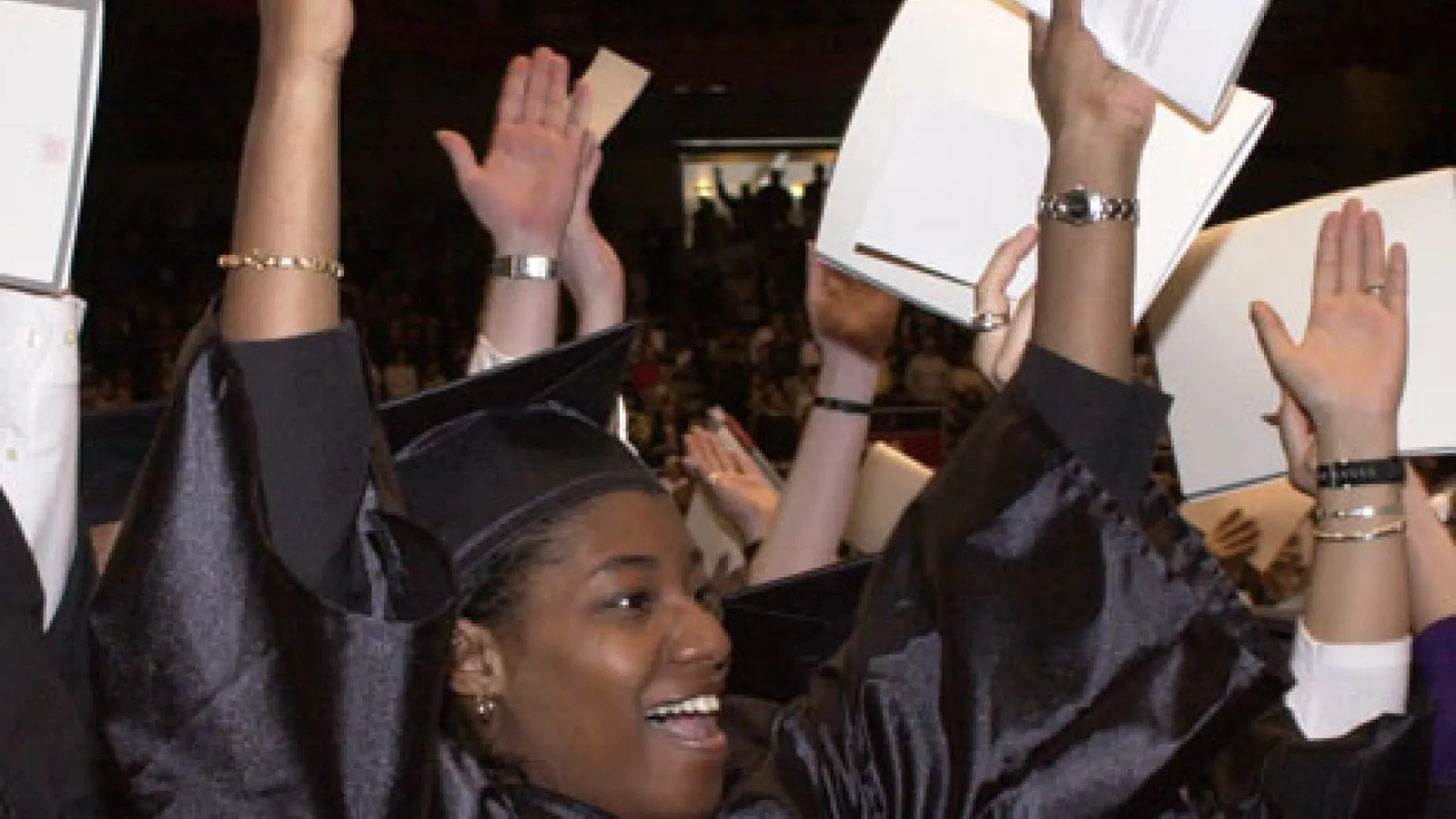 Students celebrating graduating.