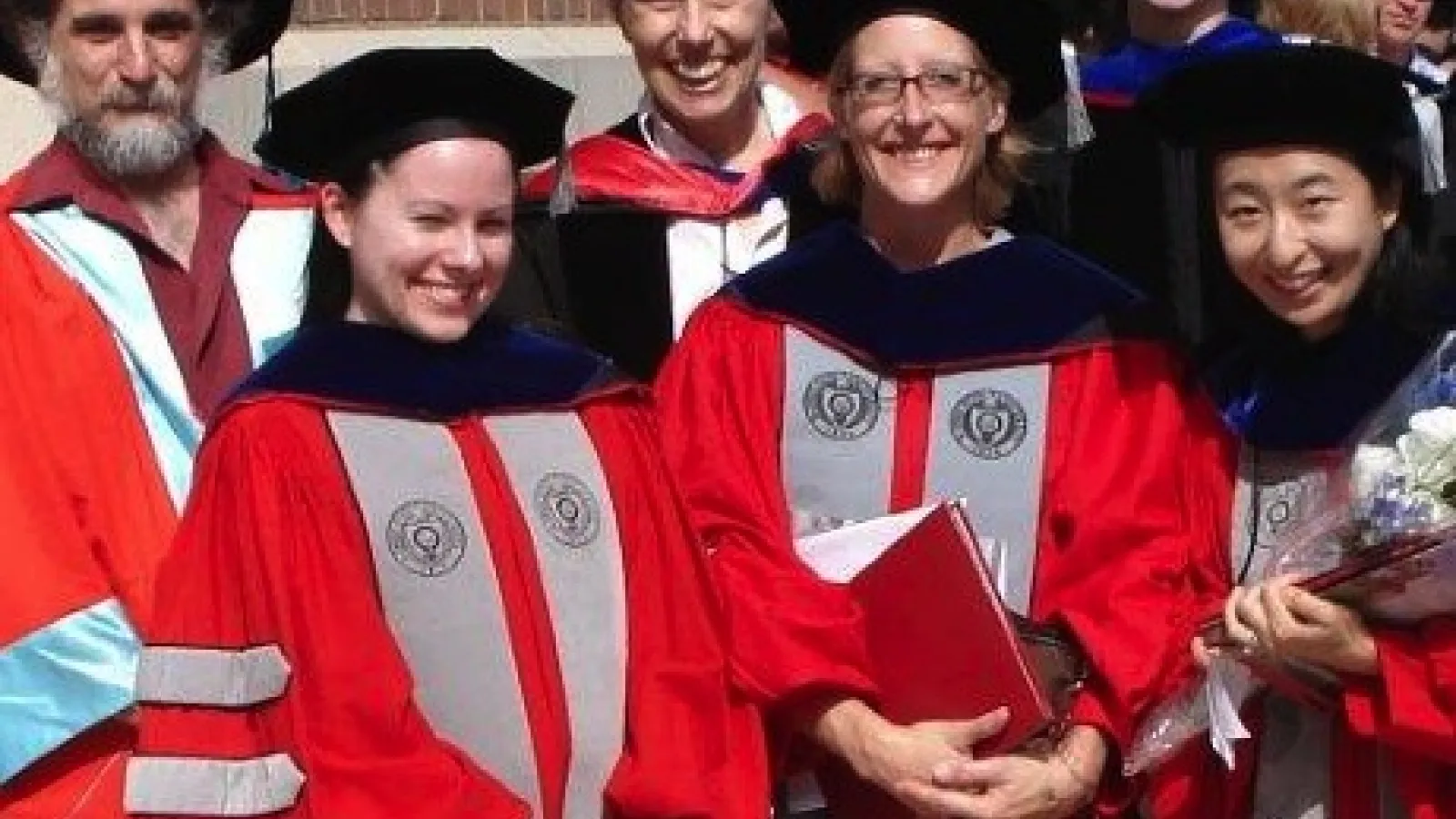 Three new PhDs Liz McCullough, Bridget Smith, and Dahee Kim at Summer Commencement 2013. 