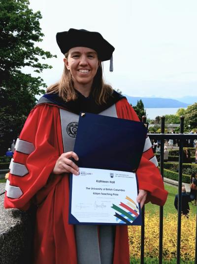 Kathleen Currie Hall holding the Killam award that she won