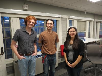 three people posing for a picture
