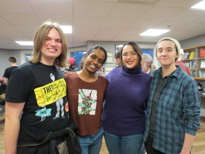 four people posing for a picture