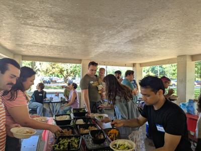 people visiting at the welcome picnic