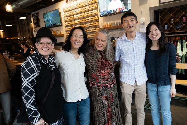 Shari Speer with former students posing together