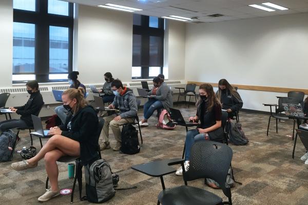 Students socially-distancing in a linguistics class