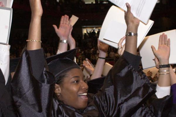 Students celebrating graduating.