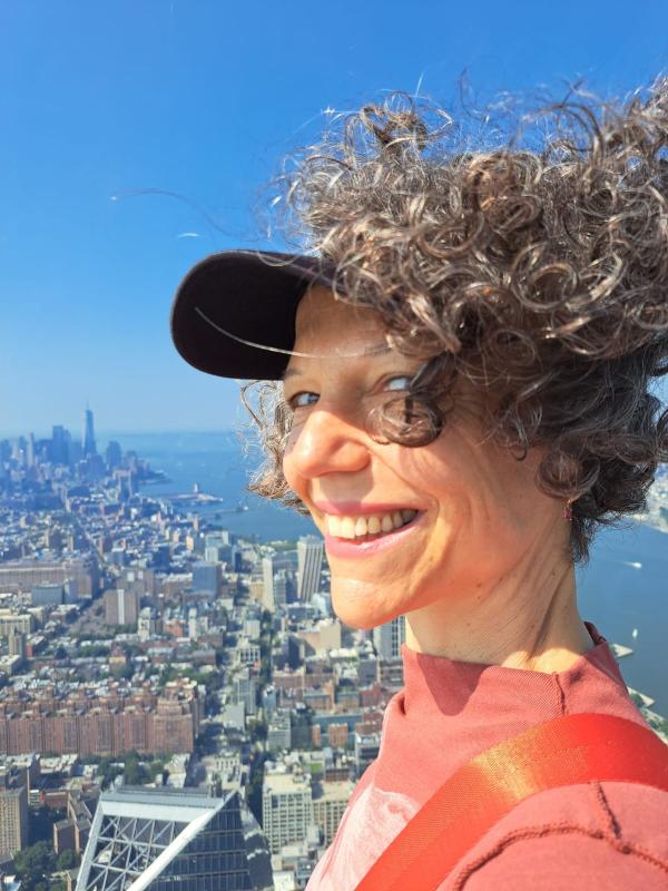 Laura Smiling with NYC in the background