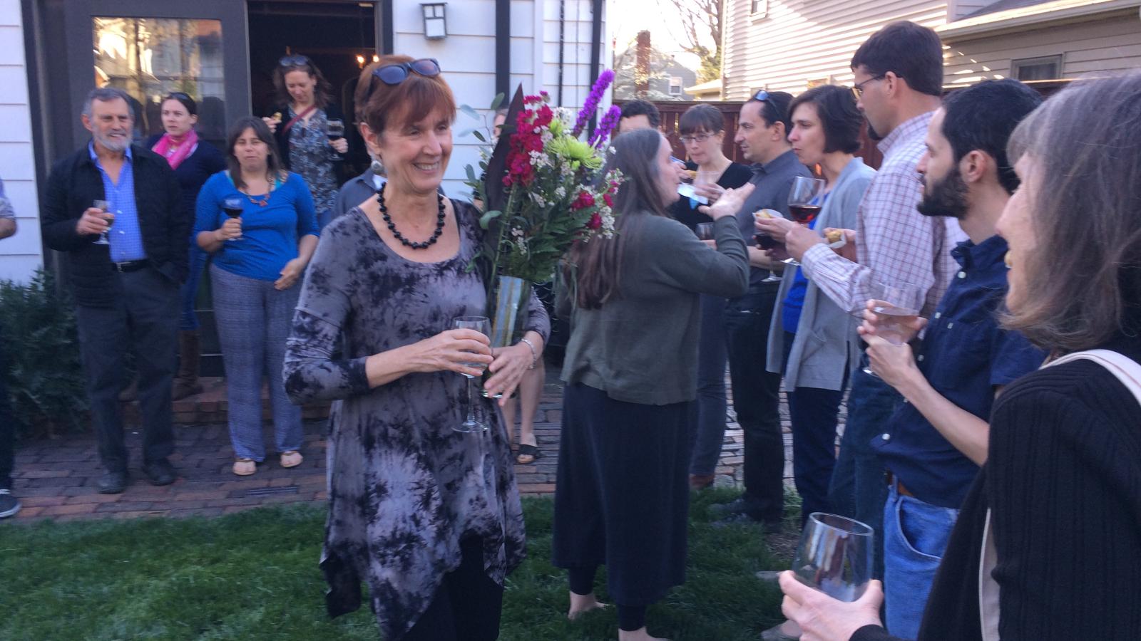 Julie with flowers at former advisor Mary Beckman's retirement party