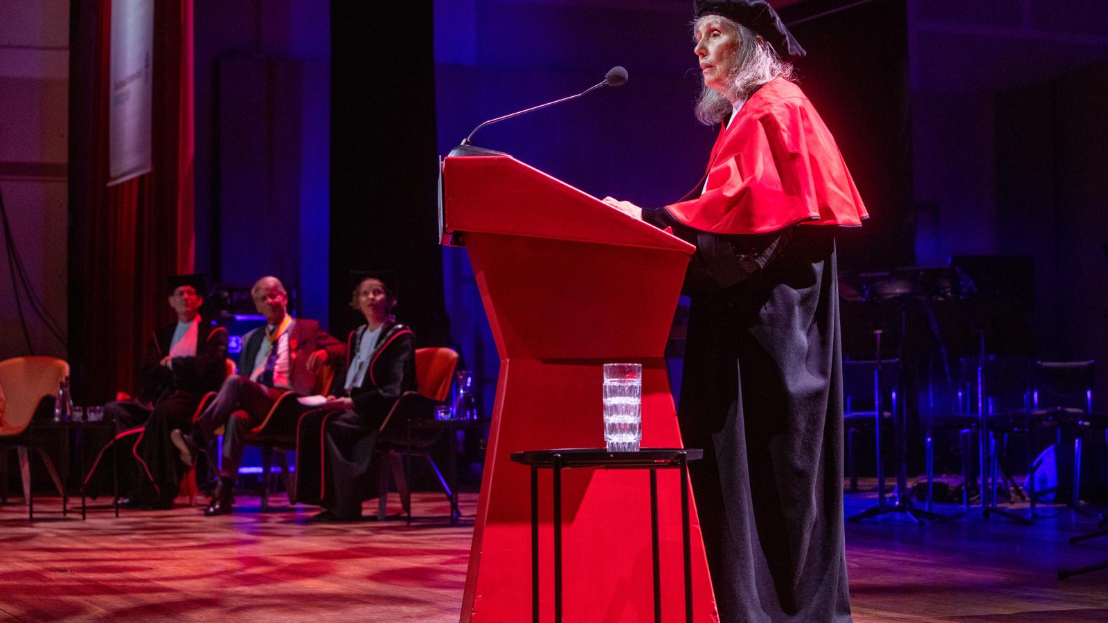 Mary Beckman accepting her honorary doctorate from Radboud University