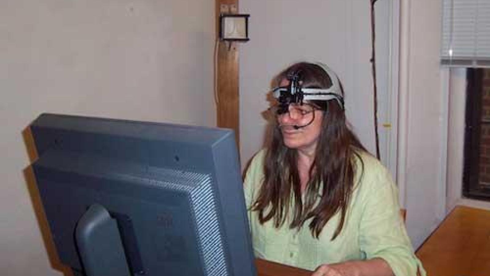 Front view of an individual wearing and using the ASL eye-tracker (slide 5 of 5)