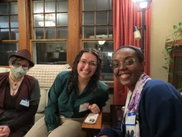 faculty and students sitting on a couch, posing for the picture